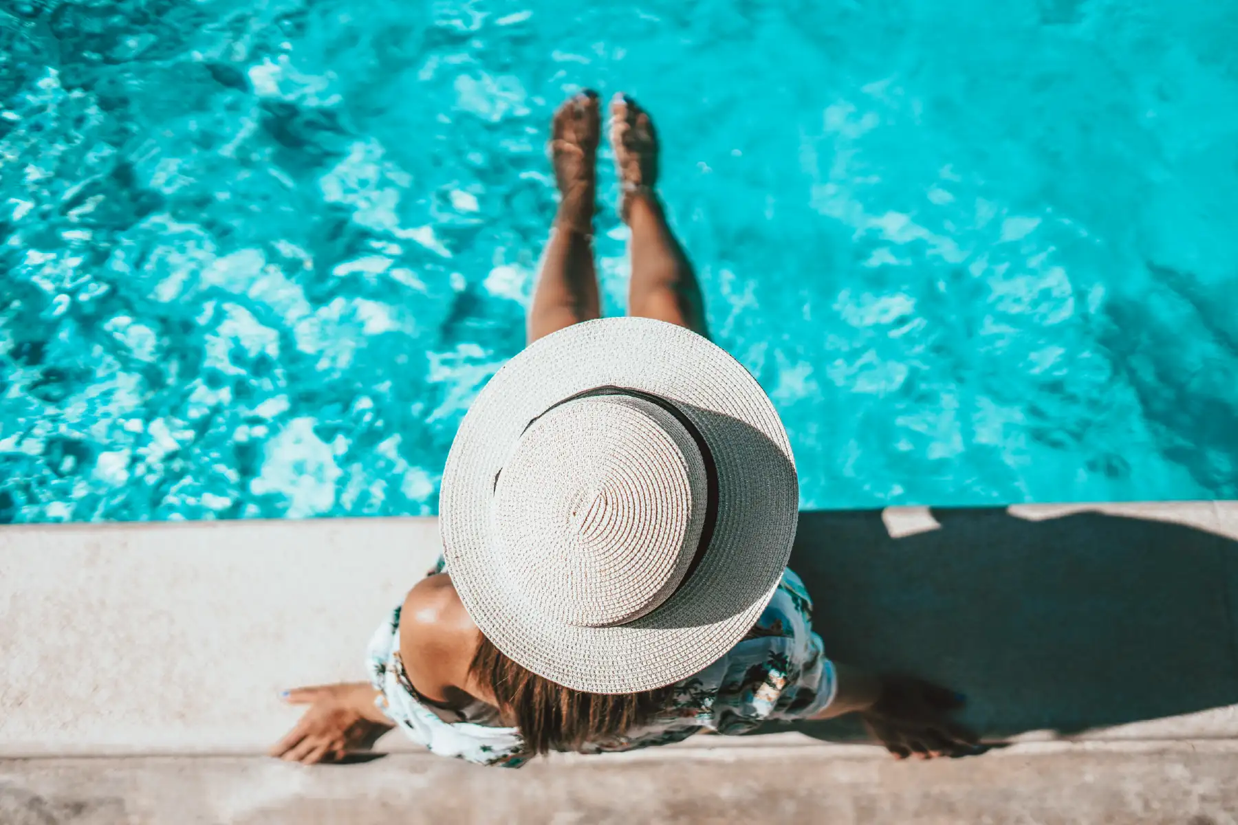Utah pool contractor from Barr Pools reviewing custom pool designs with homeowners